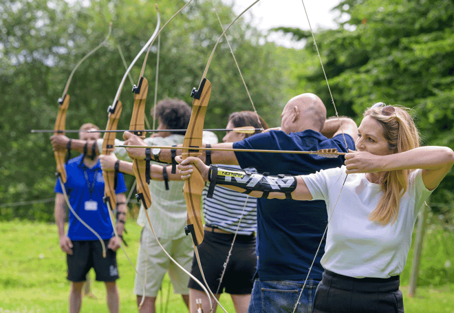 Group of people playing archery 